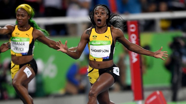 Elaine Thompson of Jamaica celebrates winning the women's 100m final ahead of Shelly-Ann Fraser-Pryce, who came third.