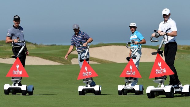 Henrik Stenson, Jordan Spieth, Rickie Fowler and Rory McIlroy riding 'golfboards' at Saadiyat Beach Golf Club before the Abu Dhabi Championship.