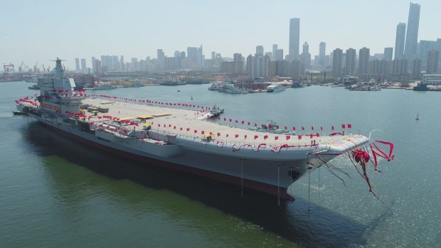 China launched its first aircraft carrier on Wednesday, in a demonstration of its determination to safeguard its maritime territorial claims and crucial trade routes.