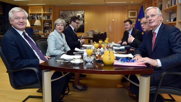 From left, Britain's Secretary of State for Exiting the European Union David Davis,  Theresa May, Jean-Claude Juncker and EU's chief Brexit negotiator Michel Barnier.