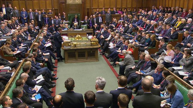 British Prime Minister David Cameron, standing centre left, in a packed House of Commons in London during the war against Islamic State debate.