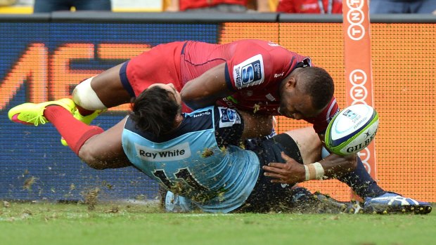 So close:  Eto Nabuli of the Reds is prevented from scoring a try by Zac Guildford of the Waratahs.