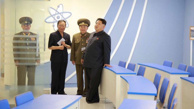 North Korean leader Kim Jong-Un (right) stands during a visit to a newly-built building of the Automation Institute of the Kim Chaek University of Technology in Pyongyang, in this undated picture released by North Korea's Central News Agency.
