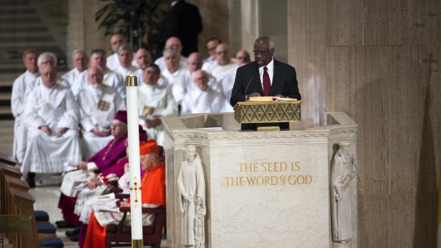 Supreme Court judge Clarence Thomas gives a reading during the funeral of Justice Antonin Scalia.