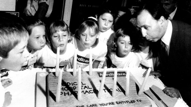 Prime Minister Paul Keating photographed with cute children and a cake - it wouldn't be allowed under modern section 44 rules.