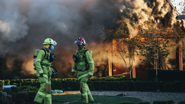 Emergency services work to extinguish the fire on Thursday