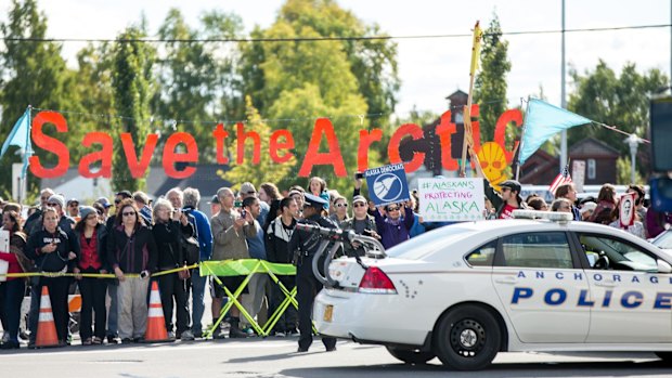 Campaigners gather outside the Dena'ina Civic and Convention Centre in Anchorage, Alaska, before a speech there by US President Barack Obama.