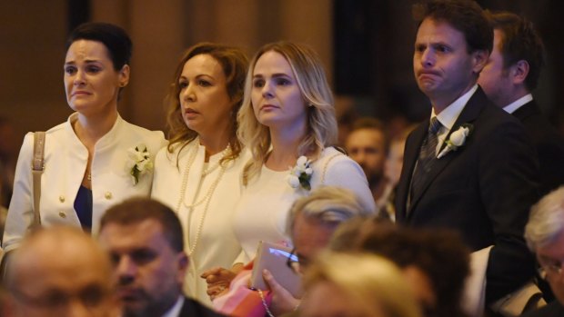 The family of veteran soccer broadcaster Les Murray attend his state funeral at St. Mary's Cathedral in Sydney.