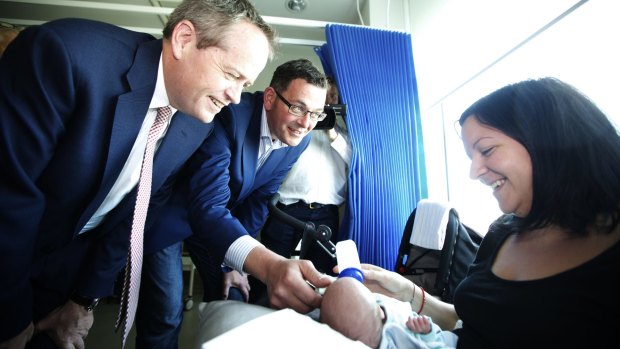 Labor leaders Bill Shorten and Daniel Andrews with baby Maksim Pesic at Sunshine Hospital.