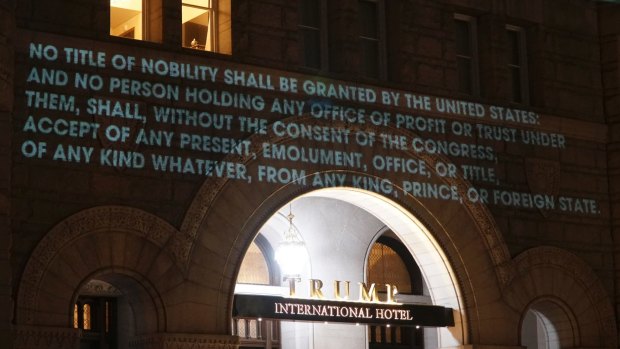 The Emoluments clause which aims to prevent foreign financial ties as projected onto the Trump International Hotel in Washington in May.