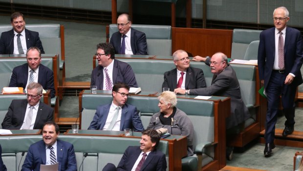Prime Minister Malcolm Turnbull passes George Christensen during the vote.