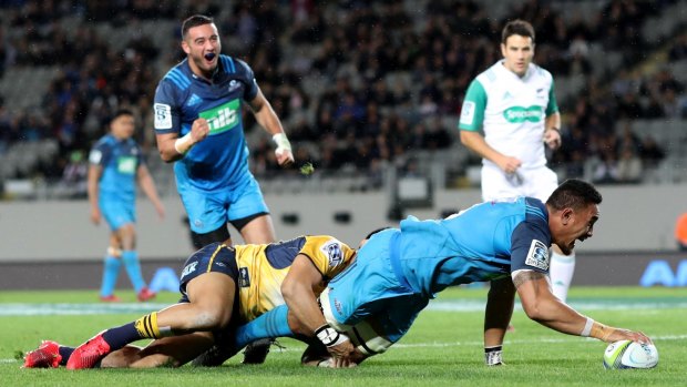 Stretch: Jerome Kaino reaches across the line to score against the Brumbies.