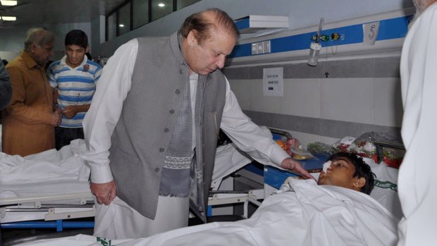 Pakistan's Prime Minister Nawaz Sharif, seen here comforting a victim of the Lahore bombing in March, had vowed to target the Taliban.