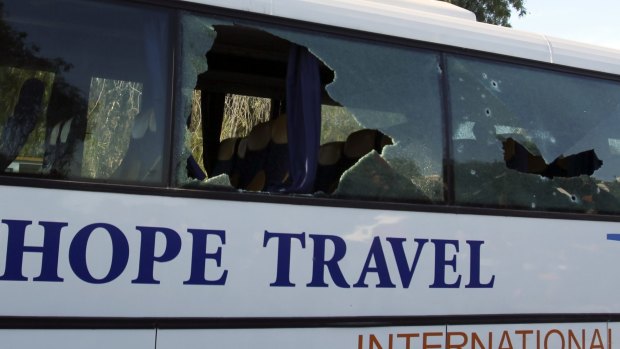 A damaged bus is seen after the attack.