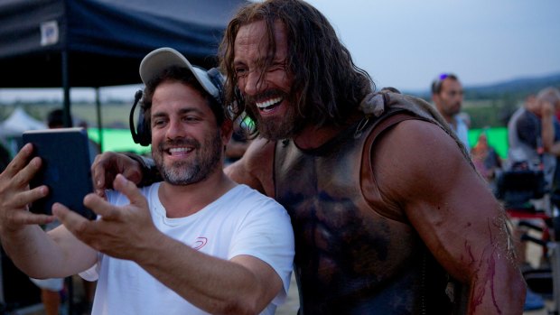 Director Brett Ratner and Dwayne Johnson on the set of 2014's <i>Hercules</i>.
