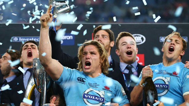 First wins first: Waratahs captain Michael Hooper celebrates with teammates after last year's victory.