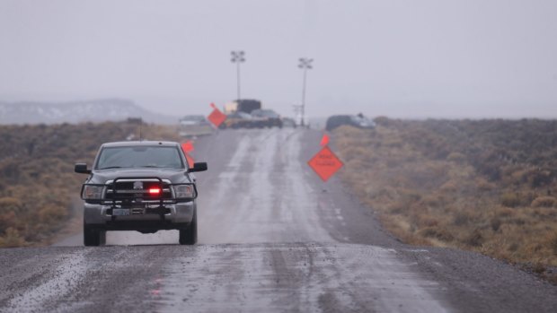 A law enforcement vehicle heads away from a roadblock near the Malheur National Wildlife Refuge in Harney County, Oregon on Thursday. 