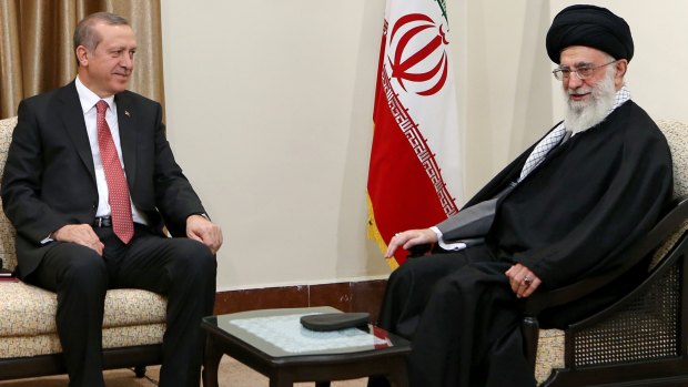 Iranian Supreme Leader Ayatollah Ali Khamenei, right, talks with Turkish President Recep Tayyip Erdogan in Tehran on April 7.