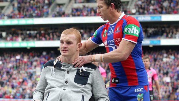 "I don't know whether I've come to peace. I reckon every day I ask myself the same thing": Alex McKinnon and Kurt Gidley, pictured last year, during the NRL's "Rise For Alex" round.