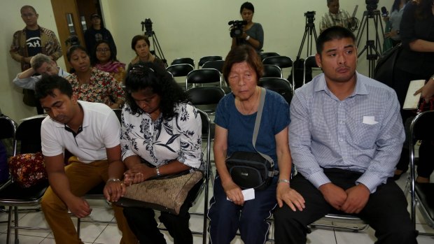 From left: Myuran Sukumaran's brother, Chinthu, mother Raji, Andrew Chan's mother, Helen, and brother Michael.