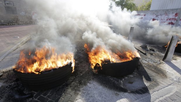 Allies of Saudi Arabia, including neighbouring Bahrain, followed the kingdom's lead on Monday and began scaling down their diplomatic ties to Iran in the wake of the ransacking of Saudi.  Tire fires burn in a third  day of protests in Bahrain.