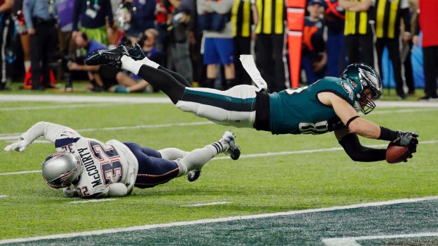 Soaring: Eagles tight end Zach Ertz dives into the end zone for a touchdown in the fourth quarter.