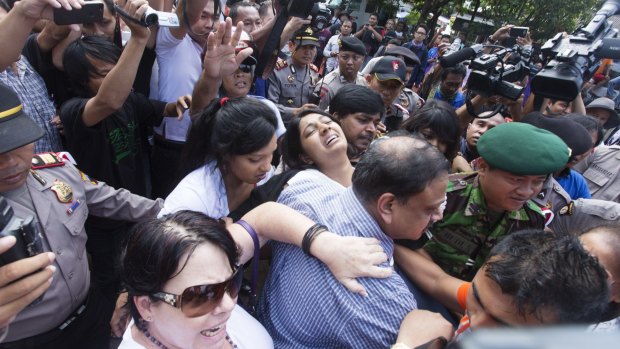 Myuran Sukumaran's sister, Brintha, is overcome on her way to Nusakambangan island.