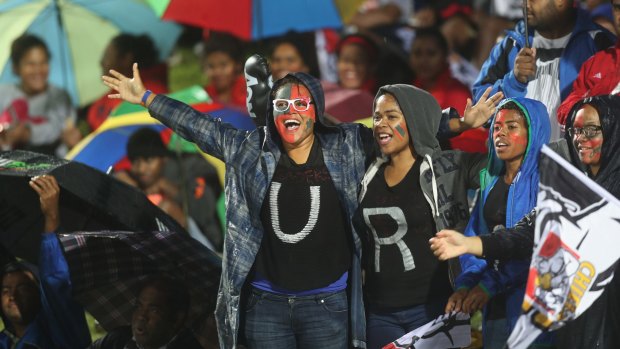 Fiji fiesta: Fans enjoy the atmosphere despite the rain as Super Rugby travelled to Suva.