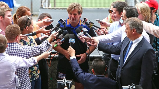 Swamped: The media engulfs Canterbury coach Des Hasler at Belmore. 