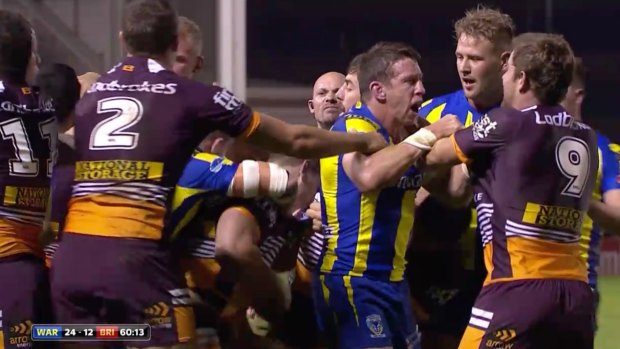 The biff is back: Bronocs players mill around Wolves player Kurt Gidley during an on-field brawl.