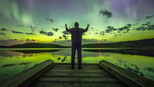 Photographer Neil Zeller admires the Northern Lights