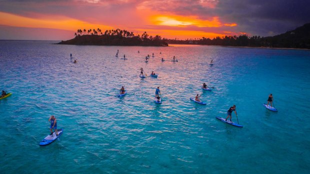 Paddleboarding in the Cook Islands.

