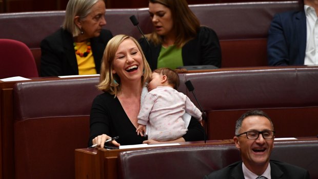 Greens co-deputy leader Larissa Waters soothes baby Alia Joy after breastfeeding her in the Senate.