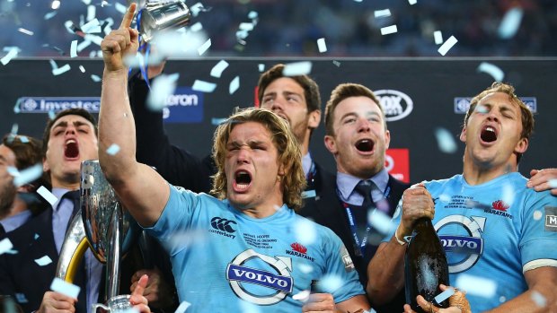 Blue beauties: The Waratahs' Michael Hooper celebrates with teammates after winning the 2014 Super Rugby title.