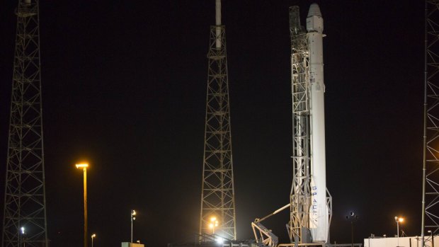 Delayed ... The Falcon 9 rocket, to be launched by SpaceX on a cargo re-supply service mission to the International Space Station, sits on launch pad 40 at Cape Canaveral Air Force Station in Florida.