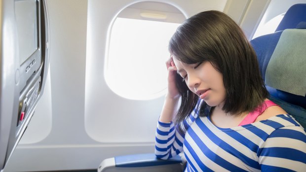 Plane toilets and tray tables contain germs and bacteria that can make you sick.