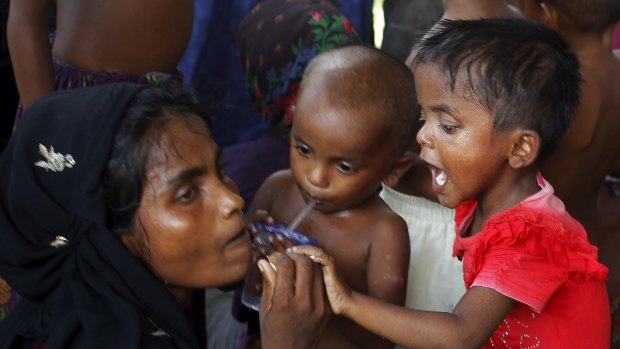 A Rohingya family pictured in May who arrived by boat in Indonesia's Aceh province. 