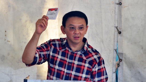 Jakarta's governor Basuki "Ahok" Tjahaja Purnama casts his ballot on Wednesday.