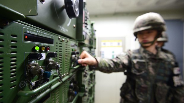 South Korean soldiers operate loudspeakers near the border with North Korea in a propaganda battle.