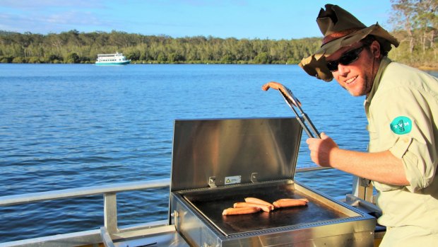 Paradise is cooking snags on the custom-made BBQ boat.