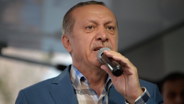 Turkish President Tayyip Erdogan delivers a speech to his supporters in Istanbul after the failed coup.