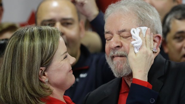 Worker's Party president, Senator Gleisi Hoffmann, wipes sweat from the face of former Brazilian president Lula in July.