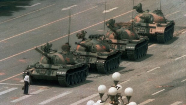 The famous confrontation between a lone protester and a column of tanks during the Tiananmen Square crackdown on June 5, 1989. Hu Yaobang's death triggered the pro-democracy protests.