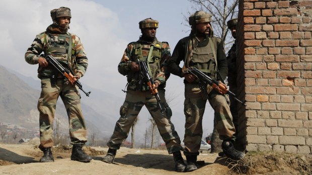 Indian Army soldiers during a gun battle with Kashmiri rebels in Pampore, near Srinagar, Kashmir, on Monday.