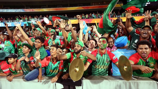 Bangladesh supporters celebrate after their country's World Cup defeat of England at Adelaide Oval on Monday.