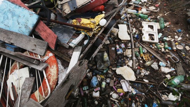 Garbage rests on the shoreline of Guanabara Bay.