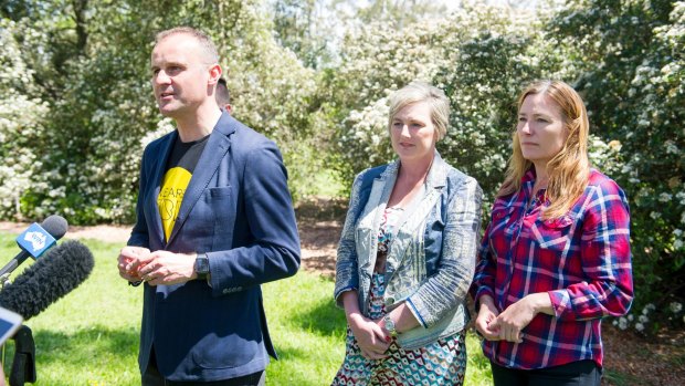 From left Chief Minister Andrew Barr, newcomer Bec Cody, and the likely deputy chief minister Yvette Berry celebrate their election win at Corroborree Park in Ainslie.