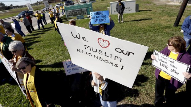 Members of several Unitarian Universalist churches and the Unitarian Voices for Justice group showed their support for Muslims Webster, Texas, on Friday.