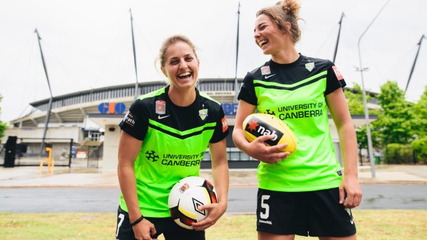 Double life: Canberra United and AFLW players Ellie Brush and Jenna McCormick outside Canberra Stadium.