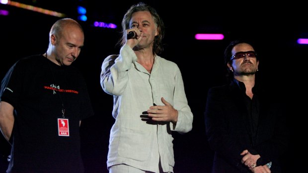 Midge Ure (left) with Bob Geldof, and Bono. Ure and Geldof together created Band Aid and Live Aid.